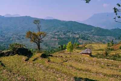 Scenic view of landscape and mountains against sky