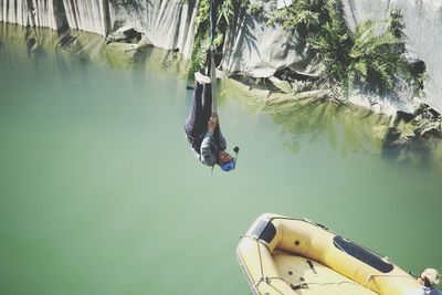 High angle view of people swimming in lake