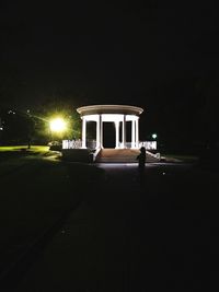 View of illuminated road at night