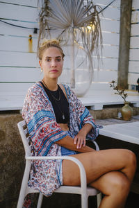 Young woman sitting on chair