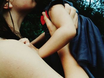 Close-up of couple holding hands