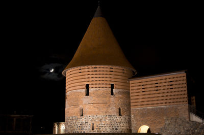 Low angle view of tower at night