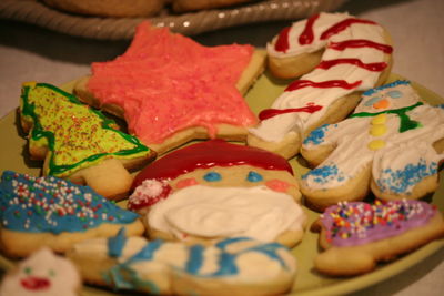 Close-up of colorful cookies served in plate on table