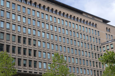 Low angle view of modern building against sky in city