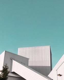 Low angle view of building against clear blue sky