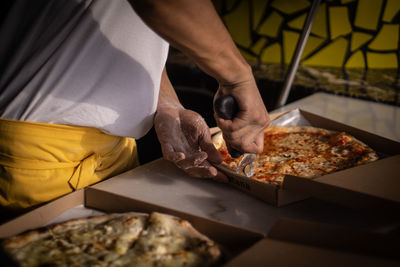 Midsection of man preparing food