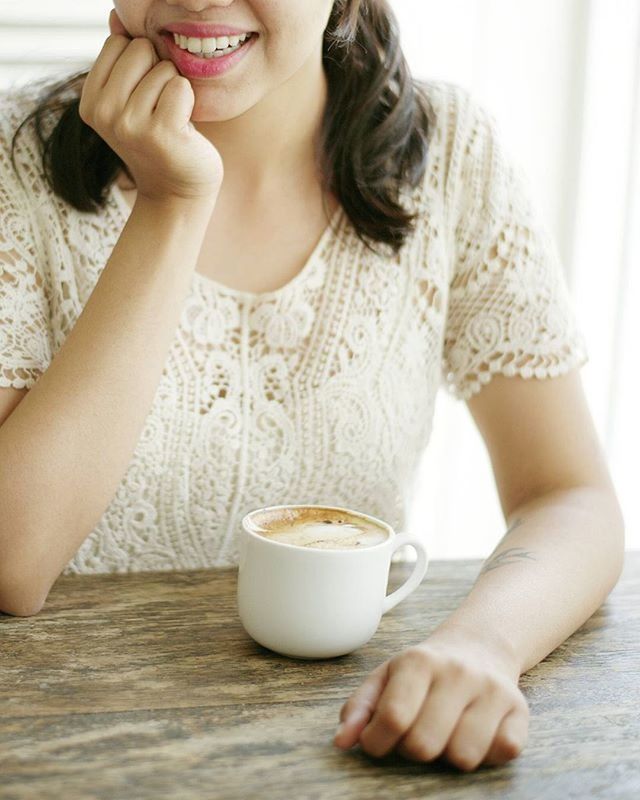 MIDSECTION OF WOMAN HOLDING BOTTLE