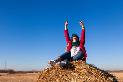 The concept of livestyle outdoor in autumn. close up of a young woman student in a warm autumn