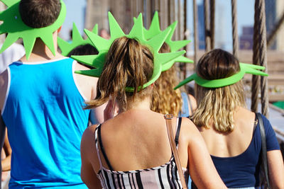 Rear view of friends wearing headdress