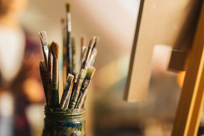 Close-up of paintbrushes on table