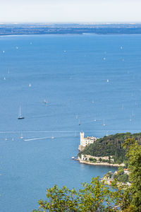 High angle view of sea against blue sky