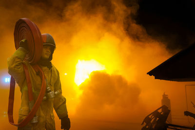 Firefighters battled the raging fire with large flames that burned down residential buildings.