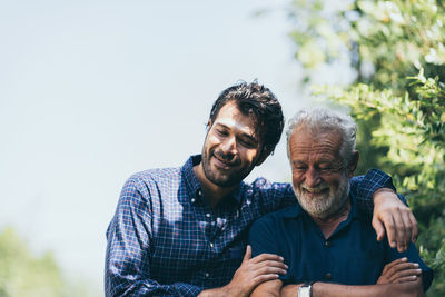 Portrait of smiling man and woman outdoors