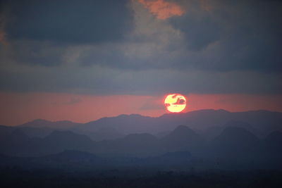 Scenic view of silhouette mountains against sky during sunset