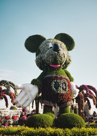 Low angle view of stuffed toy against clear sky