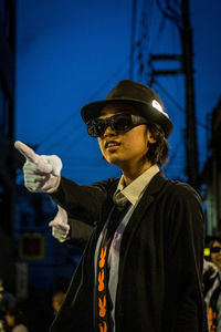 Portrait of man wearing sunglasses standing outdoors