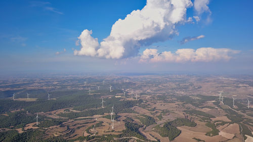 Aerial view of agricultural field against sky