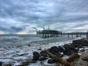 Pier over sea against sky