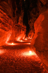 Illuminated rock formations in cave in petra ... treasure patch