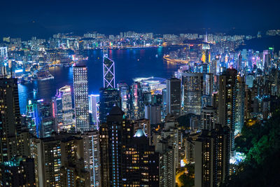 Aerial view of illuminated city buildings at night