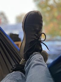 Low section of man wearing shoes. relaxing at its best