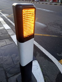 High angle view of illuminated road sign on street