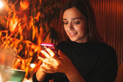 Young woman using mobile phone