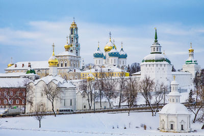 View of buildings against sky during winter