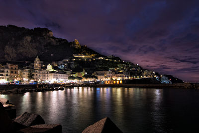 Illuminated amalfi coast against sky at night