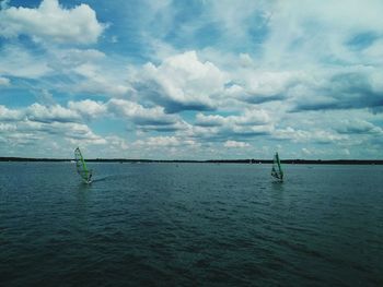 Scenic view of sea against cloudy sky