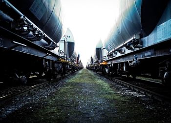 Freight trains against sky