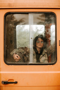 Portrait of man sitting in train