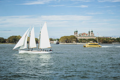 Sailboat sailing down the hudson river against the sky