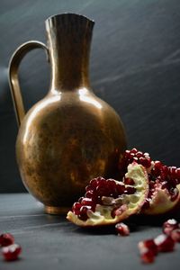 Close-up of fruits on table, pomegranate 