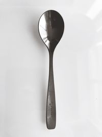 High angle view of wineglass on table against white background