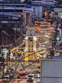 High angle view of illuminated buildings in city at night