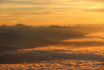 Scenic view of landscape against sky at sunset