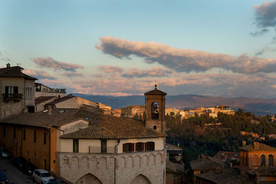 Buildings in town against sky