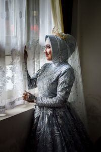 Portrait of young woman waiting for wedding ceremonial