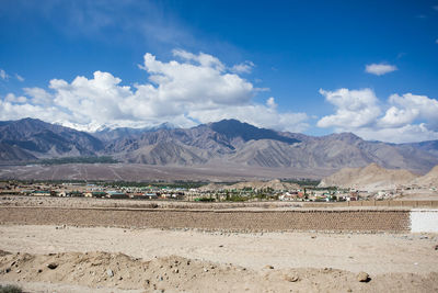 Scenic view of landscape and mountains against sky