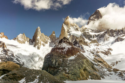 Scenic view of snowcapped mountains against sky