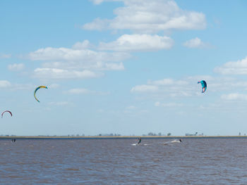 Beautiful landscape with kitesurfers