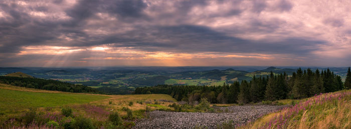 Panoramic view from wasserkuppe mountain in rhoen during sunset on cloudy summer evening 