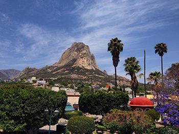 Scenic view of mountains against cloudy sky