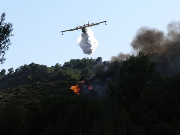 Low angle view of fire against sky