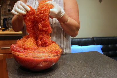 Midsection of woman holding ice cream