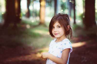 Portrait of girl standing outdoors