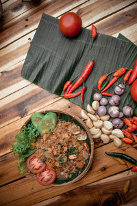 High angle view of fruits and vegetables on cutting board