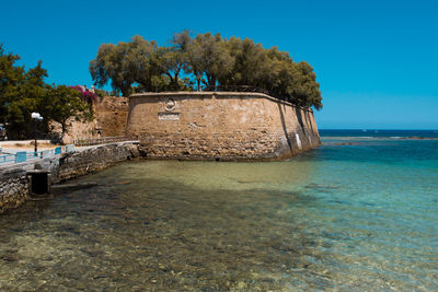 Scenic view of sea against clear blue sky