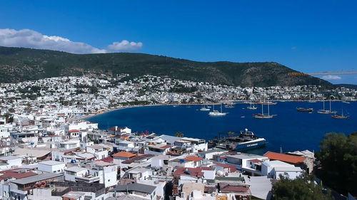 High angle view of townscape against blue sky